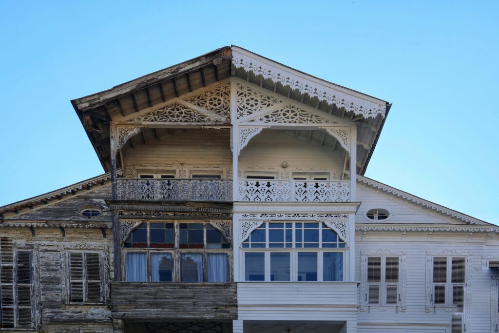 pexels-photo-16690918-16690918 A detailed view of a half-renovated wooden house facade, showing old vs new.
